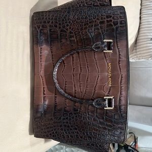 Brown crocodile print Michael Kors bag.